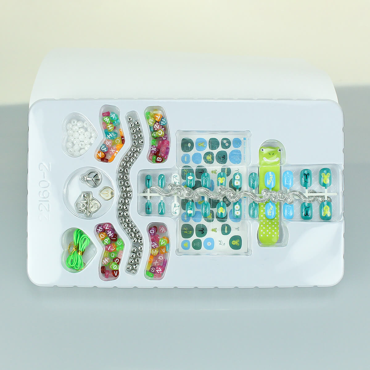 Colorful kids' DIY nail art set featuring 12 zodiac-themed designs, beads, and accessories. Safe, non-toxic, and perfect for creative fun.